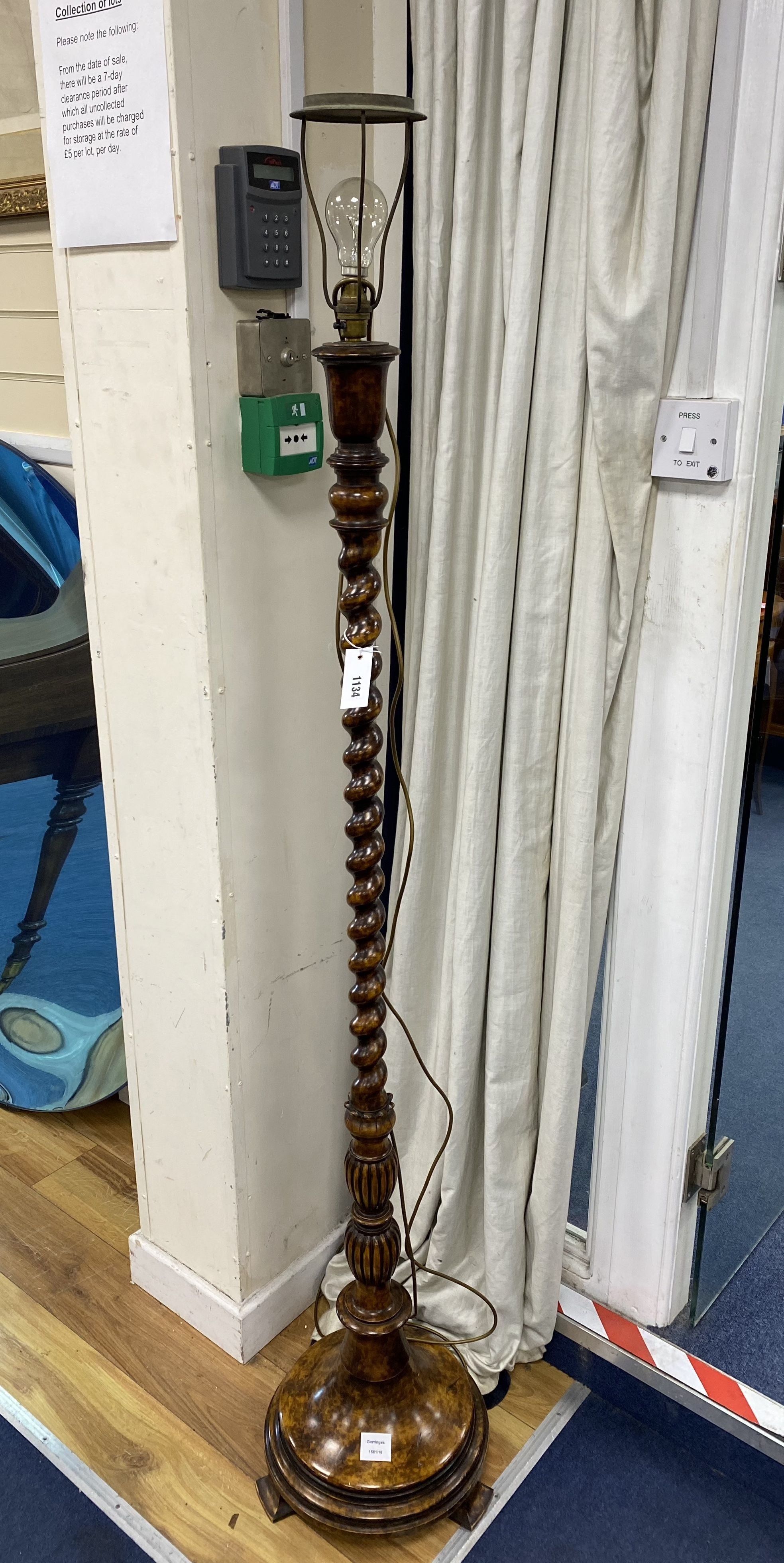 An early 20th century spiral turned walnut standard lamp, height 150cm